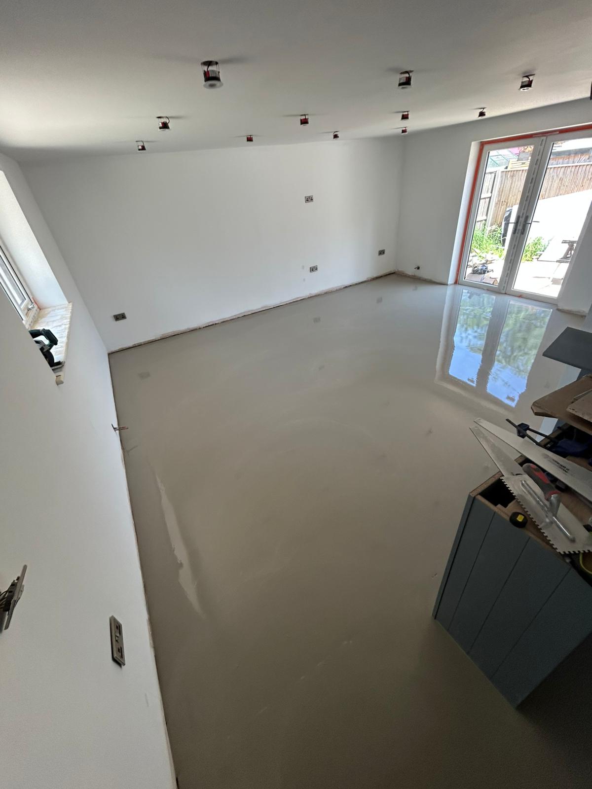 Screeded and levelled subfloor ready for installation by Compass Flooring Norfolk