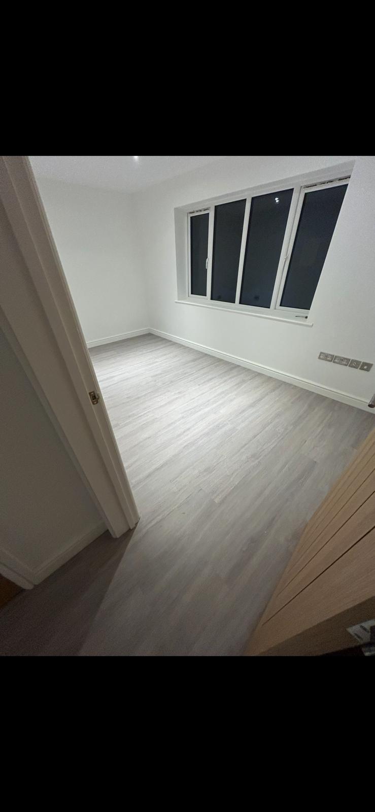 Light grey vinyl sheet flooring installed in a Norfolk property by Compass Flooring